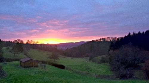 Scenic view of landscape against sky during sunset