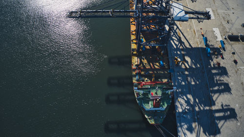 Aerial view of illuminated pier over sea