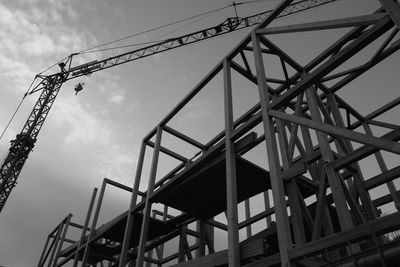 Low angle view of construction site against sky