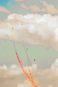 Low angle view of airplane flying against sky