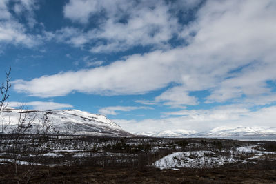 Scenic view of snowcapped mountains against sky