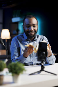 Portrait of young man using mobile phone