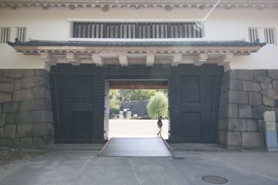 Man in front of building