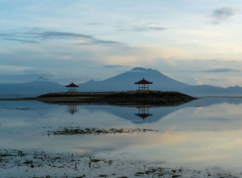 Scenic view of lake against sky during sunset