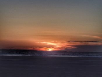 Scenic view of sea at sunset