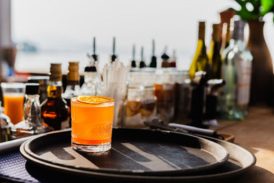 Fresh cocktail with orange juice at the bar counter.