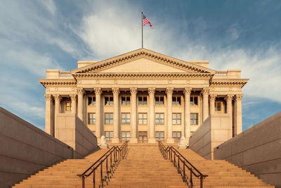 Low angle view of historical building against cloudy sky