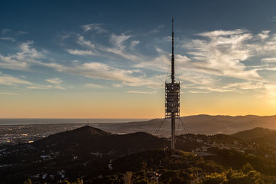 Communications tower against sky during sunset. barcelona, spain. 
