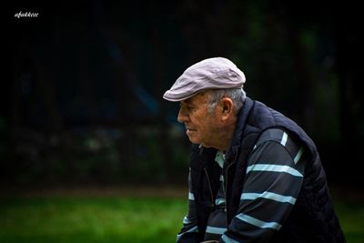 Man looking away in forest