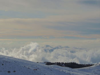 Scenic view of snow covered landscape against sky