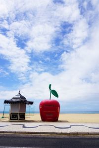 Lifeguard hut on beach against sky