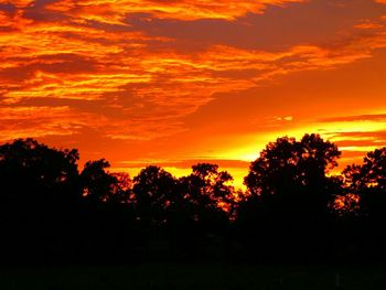 Scenic view of dramatic sky at sunset