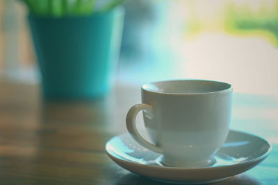 Close-up of coffee cup on table