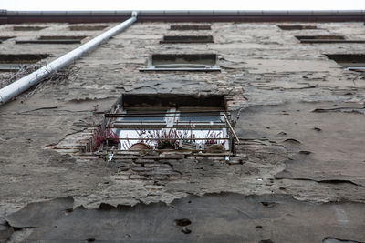 Low angle view of old abandoned building