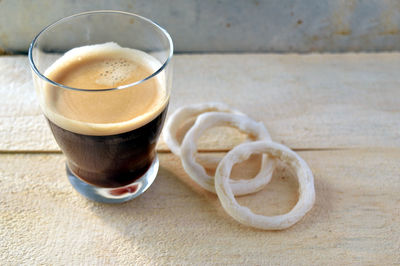 Close-up of coffee cup on table