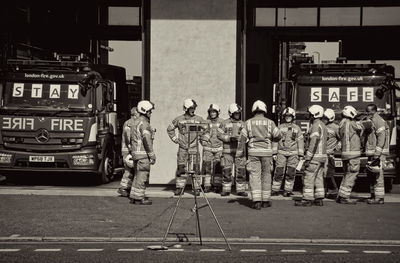 People standing on street in city