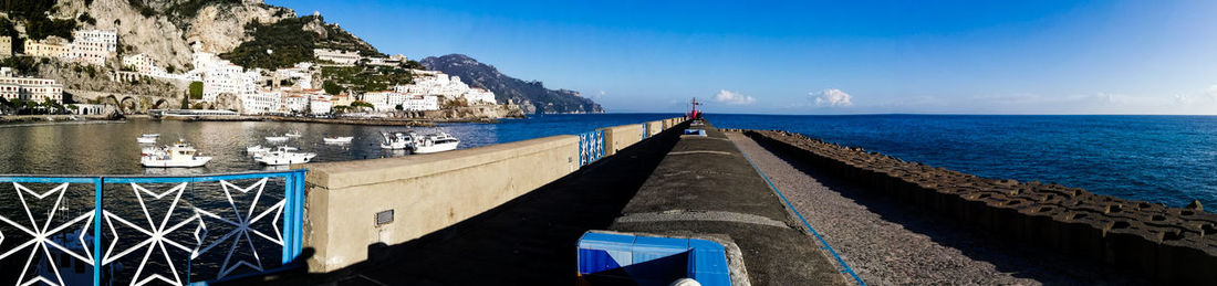 Panoramic view of sea against blue sky