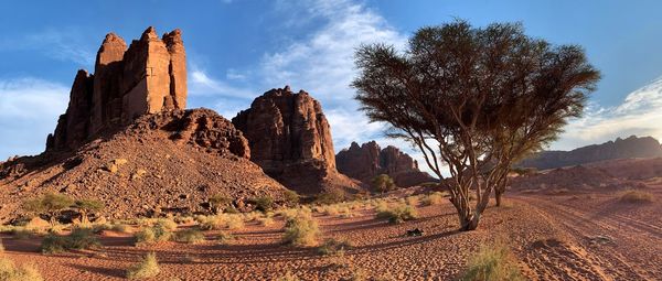 Panoramic view of rock formations on landscape against sky