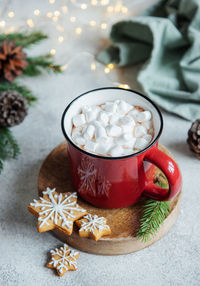 Cozy winter and christmas setting with hot cocoa and homemade cookies