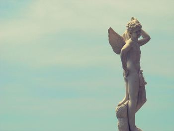 Low angle view of statue against sky