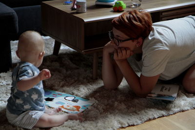 Father and son playing in kitchen