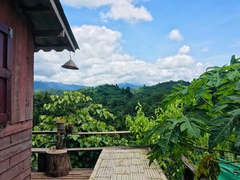 Scenic view of trees and buildings against sky