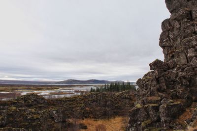 Rock formations on landscape against sky