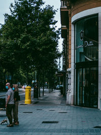 People walking on street in city