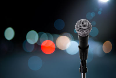 Close-up of illuminated lighting equipment at night