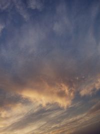 Low angle view of cloudy sky during sunset
