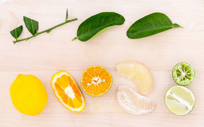 Directly above shot of various citrus fruits on table