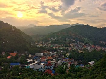 High angle view of houses and mountains against sky