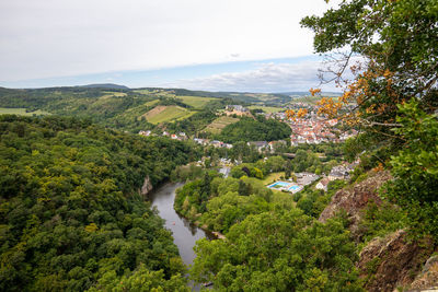 High angle view of green landscape against sky