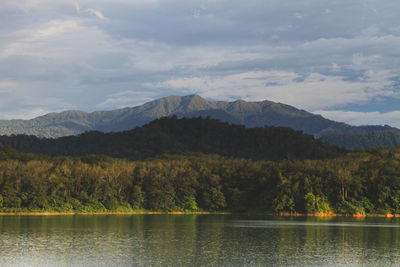 Scenic view of lake and mountains against sky