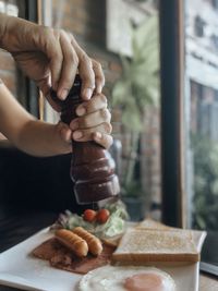 Close-up of person preparing food on table