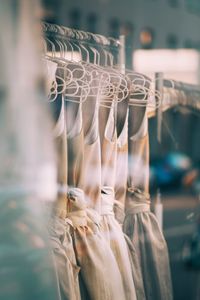 Close-up of clothes hanging on display at store