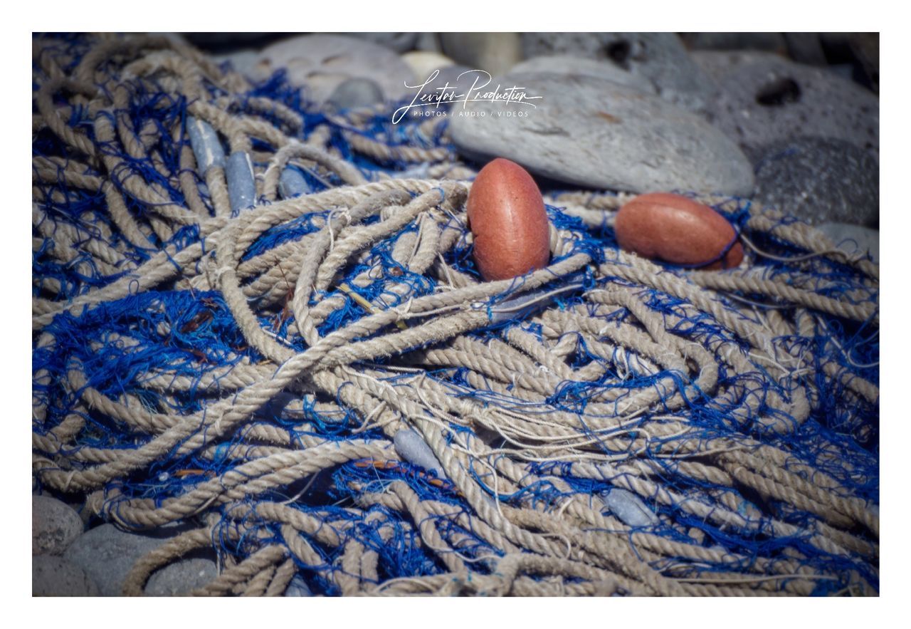 rope, blue, no people, transfer print, close-up, auto post production filter, day, fishing, full frame, fishing industry, still life, tangled, complexity, focus on foreground, buoy, commercial fishing net, fishing net, pattern, strength, outdoors