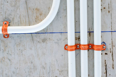 Close-up of metal railing against wall