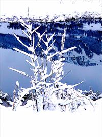 Snow covered landscape against clear sky