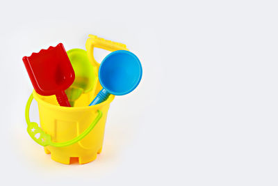 Close-up of colorful toys over white background