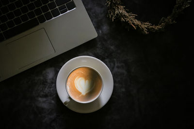 High angle view of coffee cup on table