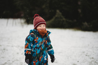 Woman looking away in snow