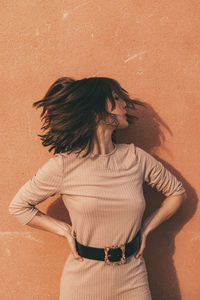 Shot of a woman turning her head playing with her hair