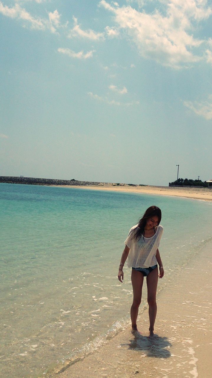 full length, lifestyles, leisure activity, water, sea, beach, casual clothing, rear view, shore, standing, sky, vacations, horizon over water, childhood, sand, person, beauty in nature, girls