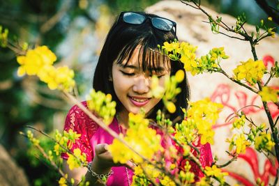 Beautiful woman with red flower