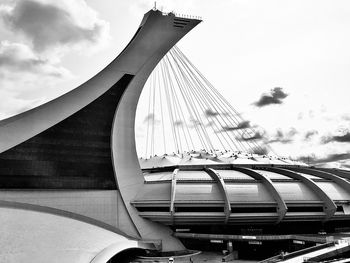 Tilt image of bridge against sky in city