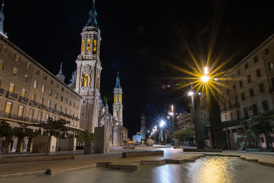 Illuminated buildings in city at night