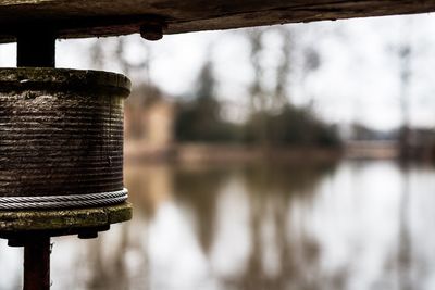 Close-up of wood against lake