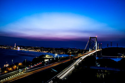 High angle view of light trails on road in city