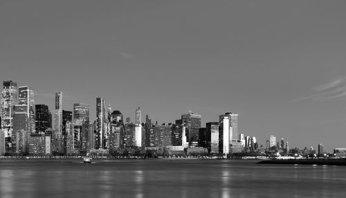 Modern buildings in city against sky